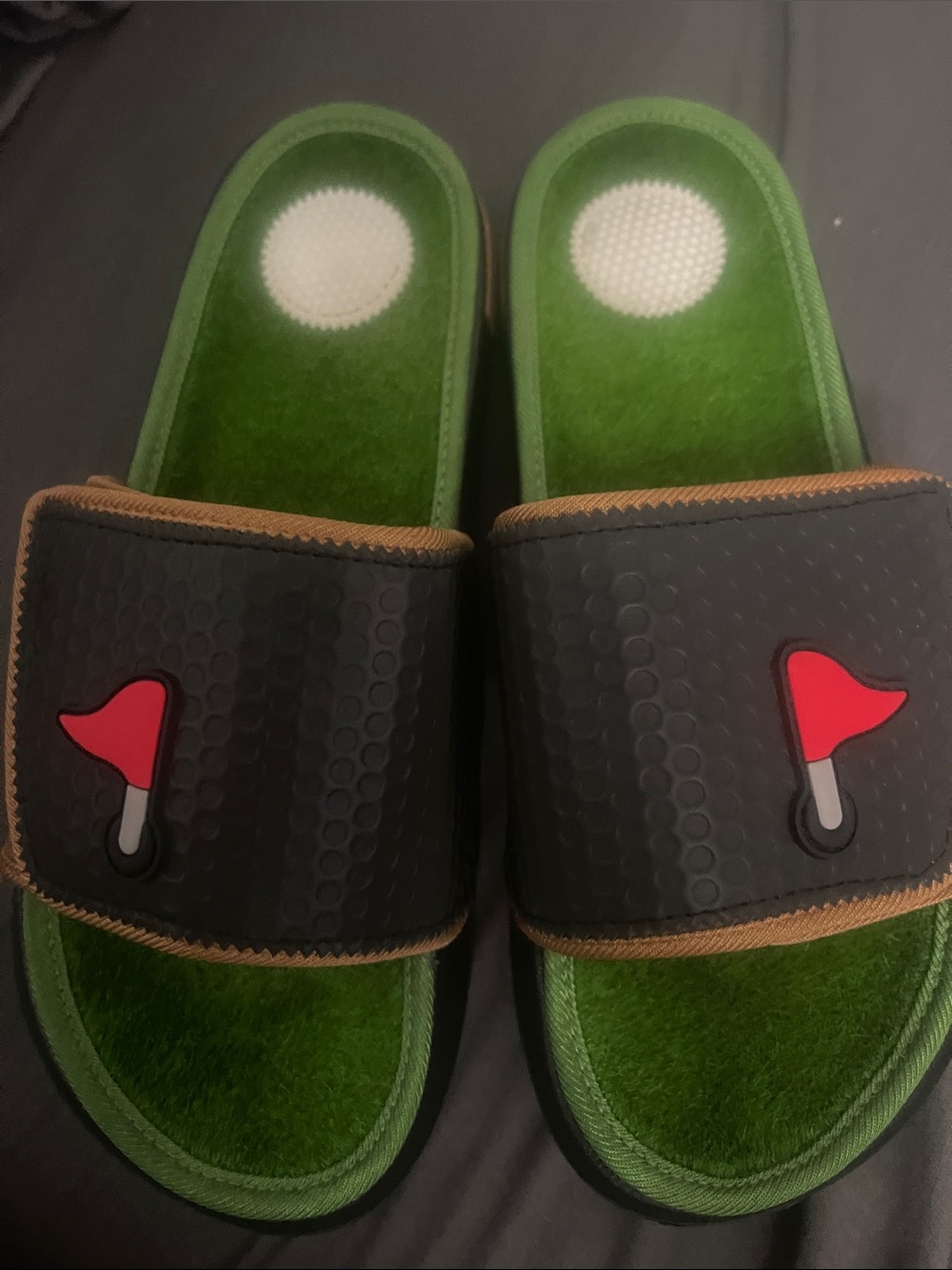 Men's Black Slide Sandals with Green Footbed and Red Flag Detail